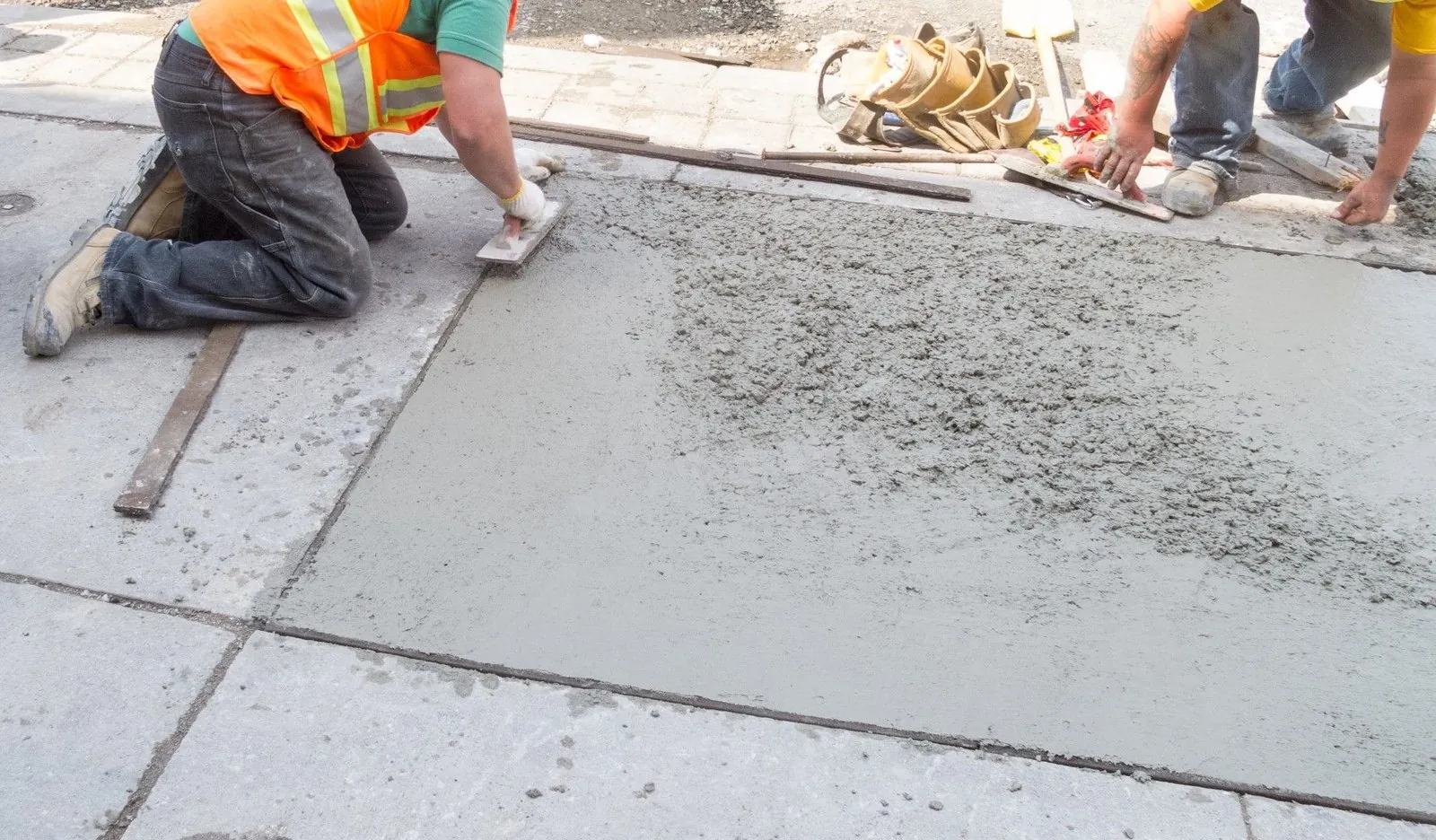Fresh concrete sidewalk with wood form stakes in Renton WA
